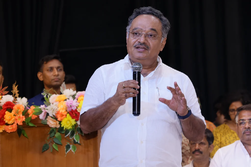 Samik Bhattacharya speaking about West Bengal Industrial Development, emphasizing heavy industries, MSME growth, employment generation, and economic progress at a public event.