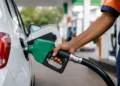 E20 Ethanol Blended Petrol being dispensed at a fuel station in India as motorists refuel their vehicles under the government's ethanol blending initiative.
