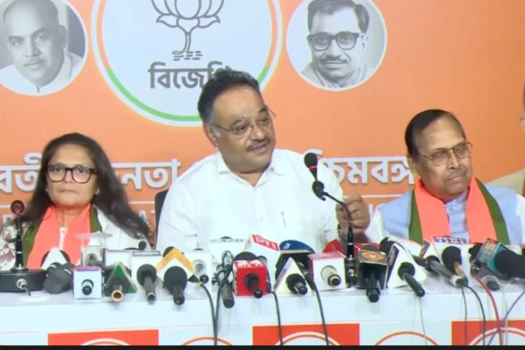 Sushmita Dev BJP candidate with BJP leader Dilip Ghosh discussing the party's stand on former Trinamool leaders joining the BJP in West Bengal politics.
