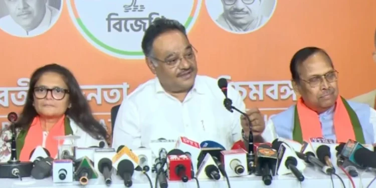 Sushmita Dev BJP candidate with BJP leader Dilip Ghosh discussing the party's stand on former Trinamool leaders joining the BJP in West Bengal politics.