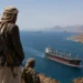 Houthis fighters and a symbolic view of the Red Sea highlighting the conflict zone near Yemen after the attack on an Indian-flagged merchant vessel.