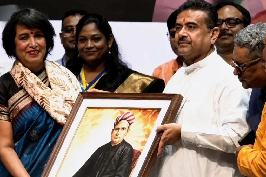 Taslima Nasrin Kolkata Visit: Shubhendu Adhikari welcomes Taslima Nasrin during the Taslima Nasrin Kolkata Visit at a public event in Rabindra Sadan, highlighting freedom of expression and cultural dialogue.