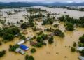 Assam Floods 2026: Floodwaters inundating villages and agricultural land in Assam as the overflowing Brahmaputra River and heavy monsoon rainfall trigger widespread devastation across the state.