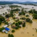 Assam Floods 2026: Floodwaters inundating villages and agricultural land in Assam as the overflowing Brahmaputra River and heavy monsoon rainfall trigger widespread devastation across the state.