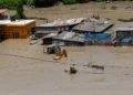 Nepal Flash Flood near the Tibet border with damaged roads, flooded areas and ongoing rescue operations.