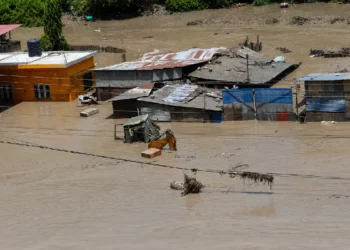 Nepal Flash Flood near the Tibet border with damaged roads, flooded areas and ongoing rescue operations.
