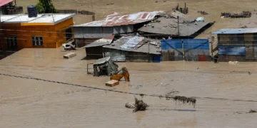 Nepal Flash Flood near the Tibet border with damaged roads, flooded areas and ongoing rescue operations.
