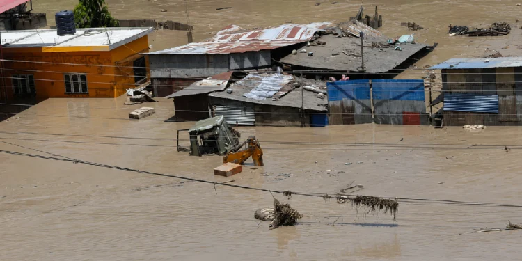 Nepal Flash Flood near the Tibet border with damaged roads, flooded areas and ongoing rescue operations.