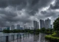 West Bengal Weather Update showing dark rain clouds over Kolkata skyline and New Town high-rise buildings before heavy monsoon rainfall.