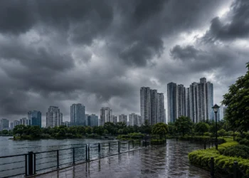 West Bengal Weather Update showing dark rain clouds over Kolkata skyline and New Town high-rise buildings before heavy monsoon rainfall.